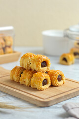 Nastar gulung or pineapple tart roll. Islamic holiday traditional snack or cookies. perfect for recipe, article, catalogue, or any commercial purposes.
