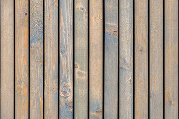 Stylish contemporary wainscoting made of thin gray-toned pine timber planks provides textured backdrop for design close view
