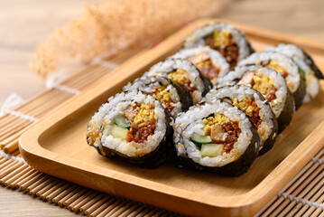 Gimbap or kimbap, Korean food made from cooked rice with vegetables, meat, egg and wrapped with dried seaweed