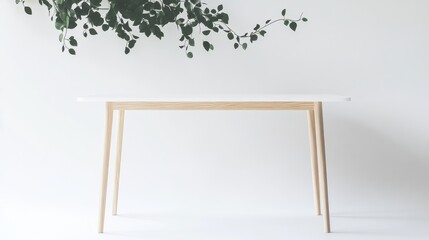 White minimalist table wooden legs green plant branch