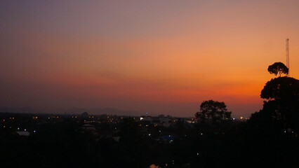 Sunset Cityscape Silhouette. Silhouette scene with buildings in the city at sunset.