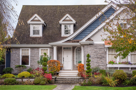 Fragment of  luxury house in fall with green trees and nice landscape in Vancouver, Canada, North America. Day time on November 2024.