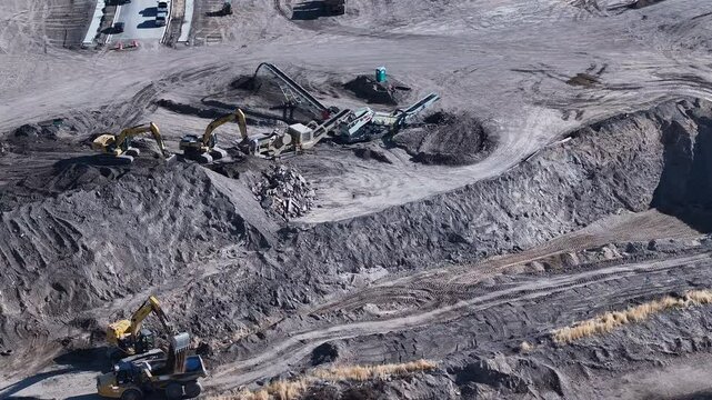 Aerial Payson Utah new equipment construction circle. Central Utah city. New home construction, heavy industrial earth moving equipment. Urban and rural landscape in mountain valley. 
