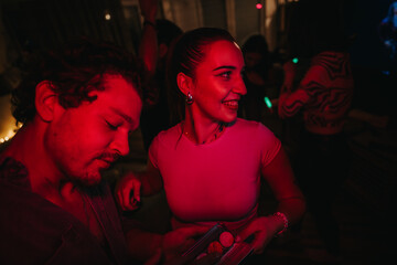 A lively scene of friends at a birthday party, immersed in celebration and joyful interactions...