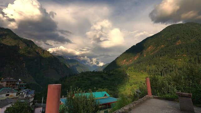 Beautiful timelapse of the mountains of parvati valley with a rainbow in between in Himachal Pradesh, India	