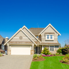 Garage door in luxury house with trees and nice landscape in Summer in Vancouver, Canada, North...