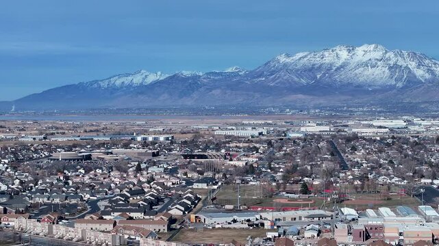 Aerial Payson Utah city neighborhood sports 2. Urban and rural landscape in mountain valley. Rapidly growing population, homes, business and schools. Neighborhood parks and recreation fields.