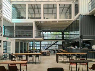 Buildings constructed by combining modular shipping containers, repurposed into cultural spaces, storage, and creative architecture.