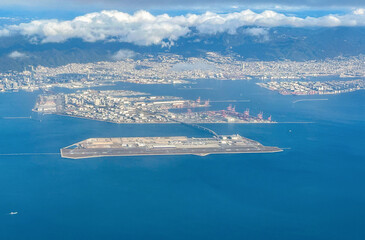 Aerial view of the Kansai International Airport (KIX) with izumisano city in background.