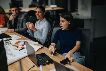 A diverse group of colleagues collaborating in a modern office setting, focused on project...