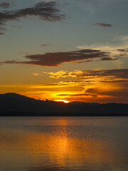 Beautiful sunset over the sea with reflection in water 