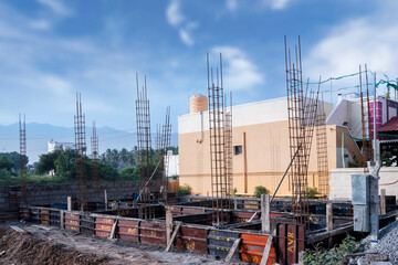 Foundation of a new house with Basement construction equipments on blue sky background