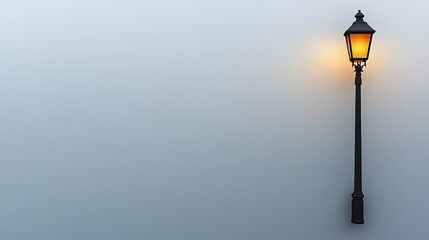 Elegant street lamp illuminating a foggy evening in a quiet urban setting during twilight hours