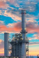 Oil refinery industry at sunset - factory - petrochemical plant