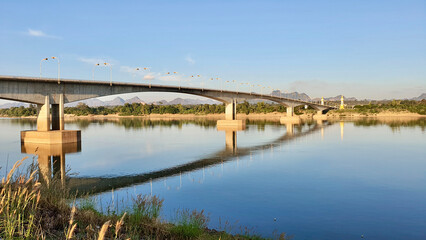 The bridge over the Mekong River in Nakhon Phanom Province, Thailand, with a view of the mountains in Laos.