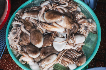 Freshly caught octopus vulgaris in a box with ice at farmer's market