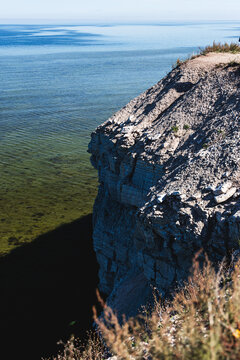 Pangas Cliff against a blue sea background