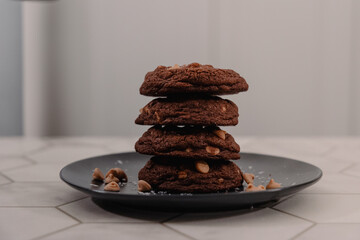 Sideview of a stack of peanut butter cookies on plate
