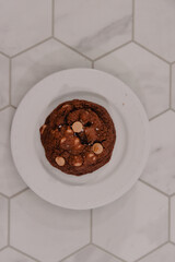 Up-close portrait of peanut butter cookie on white plate