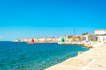 Piran, slovenia waterfront embraces adriatic coast on sunny summer day