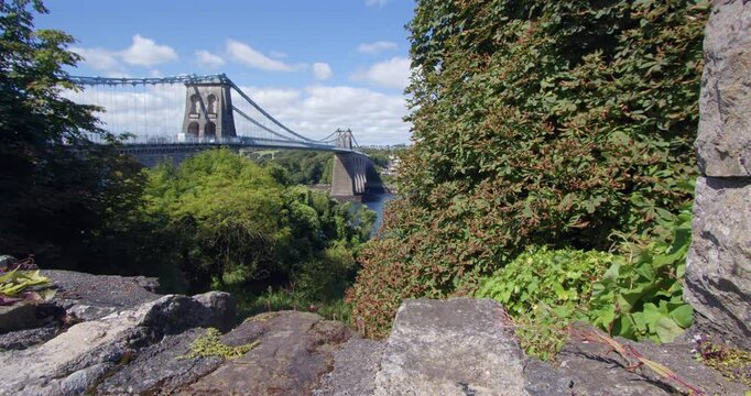 extra wide shot of the Menai Suspension Bridge with Stonewall inn foreground