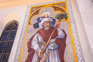 Saint christopher carrying child jesus mural painting in kranj, slovenia