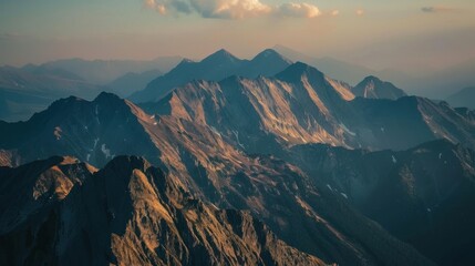 Mountain peaks illuminated by sunset, creating a serene atmosphere, natural evening light, 24-70mm focal length.