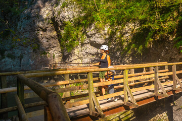 Mother and child exploring vintgar gorge in bled, slovenia