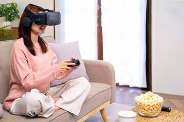 Friends playing video games wearing virtual reality glasses. Two girls having fun with vr glasses virtual reality inovation at home