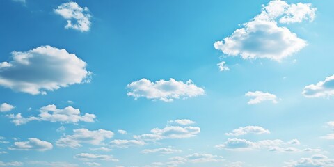 Bright blue sky adorned with tiny clouds creates a serene background, perfect for showcasing a sunny day ambiance with a clear blue sky and scattered tiny clouds for visual appeal.