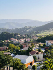 Obraz premium Picturesque hillside village landscape with lush green scenery. Nocera Umbra, Italy.