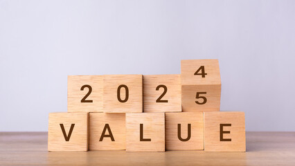 2025 value concept. Wooden blocks changing from 2024 to 2025. Business growth, goals, planning, Happy New Year