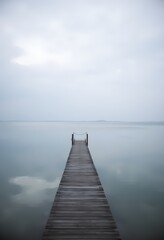 Obraz premium Serene Lake Pier Misty Morning Calm Tranquil Escape