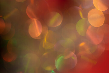 Abstract Christmas background multicolored bokeh. Unusual, sparkling, iridescent pearls with gold...