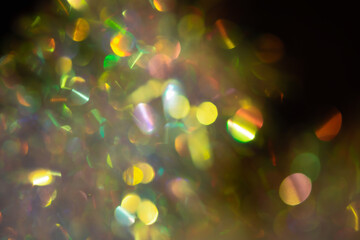 Abstract Christmas background multicolored bokeh. Unusual, sparkling, iridescent pearls with gold...
