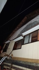 Fototapeta premium 1456)Request for removal of japanese yellow hornet nest under the eaves on the second floor of the house(Photo taken at 20:14 on June 27, 2016)