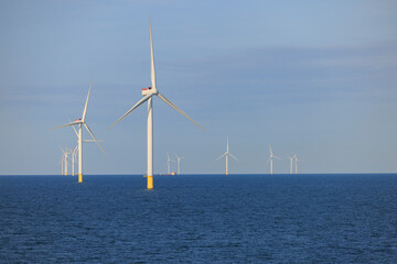 Offshore wind farm under blue clear sky