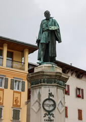 Obraz premium Pieve di Cadore, the main square with the bronze statue of Tiziano Vecellio, Dolomites, Belluno, Veneto, Italy
