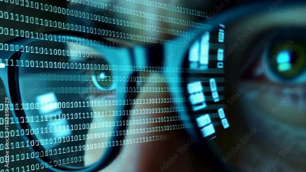 Poster a close-up of a person's face is shown, but the emphasis is on his eyes and glasses. rows of binary 
