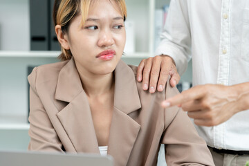 Manager or senior sexually harassed a female colleague by touch her shoulder. Sexual harassment in...