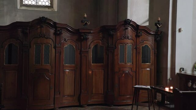 wooden baroque confessional in catholic church