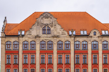 large building with many windows. old tenement house with beautiful architecture in the city. old historic buildings