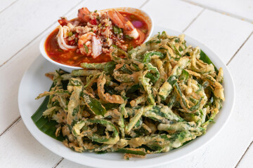 Spicy crispy morning glory salad (Yum Pak Boong Grob), is a tasty salad dish with fried morning glory and a savory spicy Thai sauce