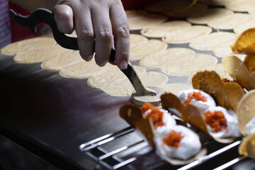 Khanom Beaung or a kind of filled pancake Thai dessert; Thai Style Crisp Tart.