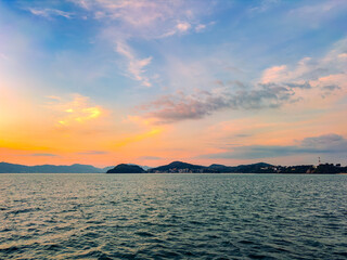 Sunset at CAPE PANWA PHUKET Thailand from sea