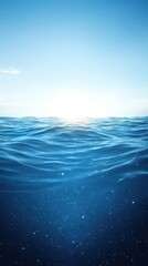 Fototapeta premium Serene Ocean Waves Under a Bright Blue Sky at Sunrise, Capturing Tranquility and Natural Beauty of the Open Sea with Gentle Swells and Sparkling Water Surface
