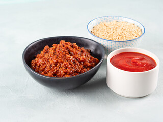 Vegan tomato bolognese ragu with soya protein granules in bowl