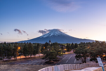 View of Mount Fuji during sunset with moving cloud on top of the mountain
