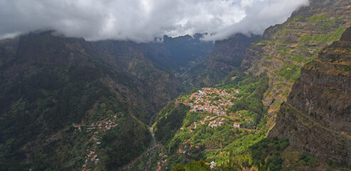 Obraz premium 'Nuns Valley' the village of Curral das Freiras sites in deep steep sided valley Madeira Portugal. 