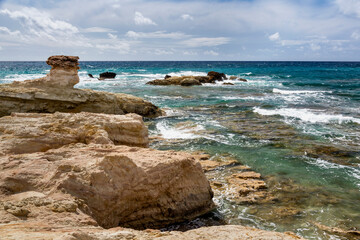 Kafizis Beach, a public beach at Cap St George Resort in the Sea Caves area of Cyprus.